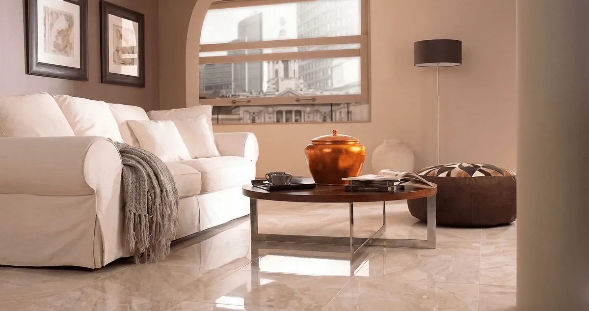 Modern living room with professionally installed marble flooring, a beige sofa, coffee table in Fort Collins, CO