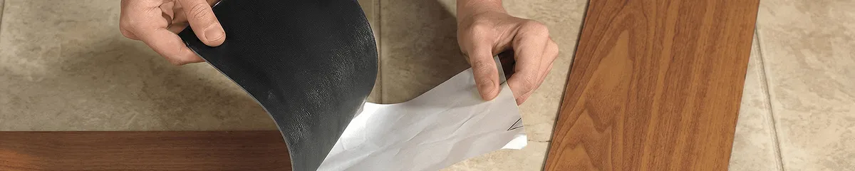 A professional installing vinyl flooring in Fort Collins, CO